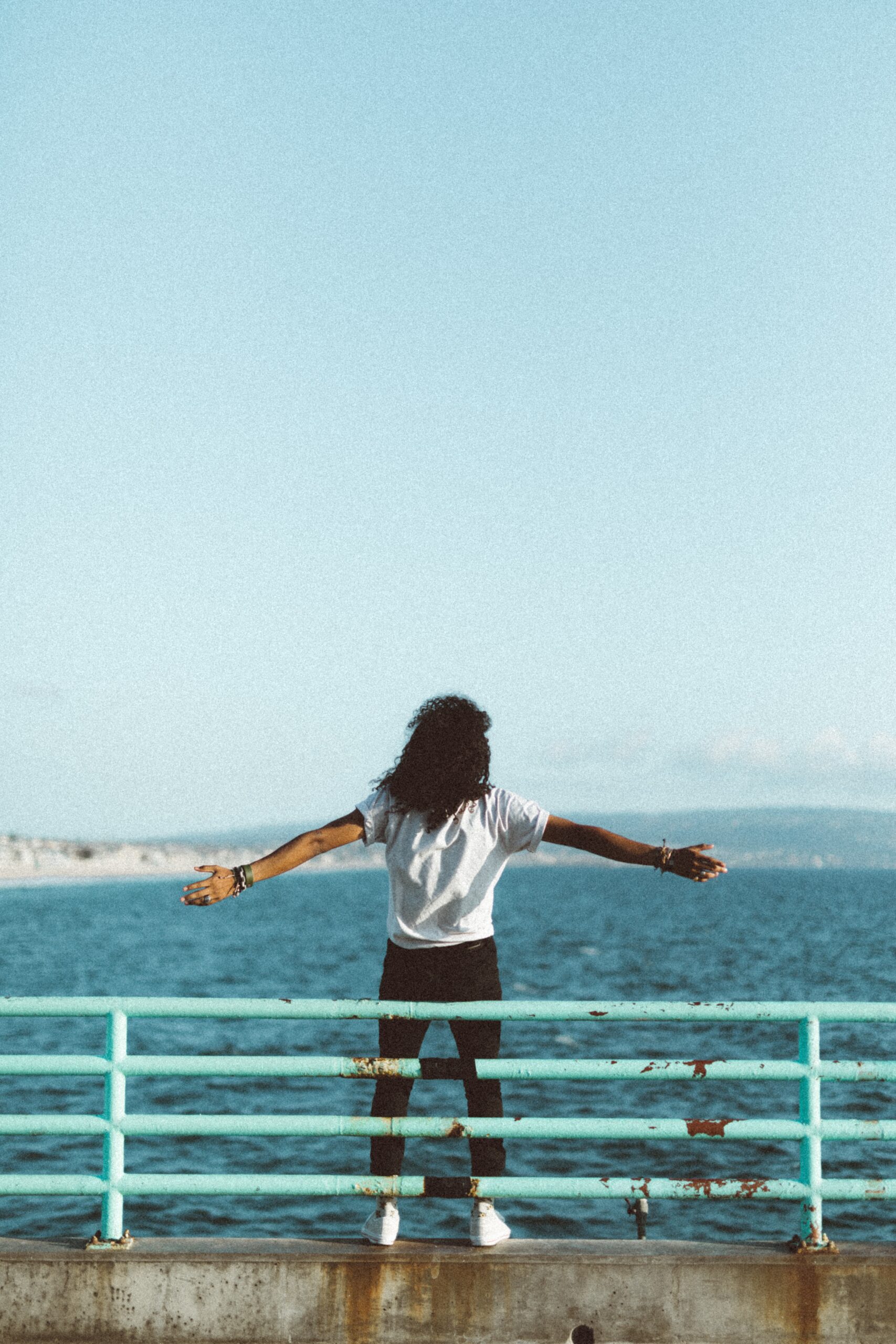 Woman holding arms back